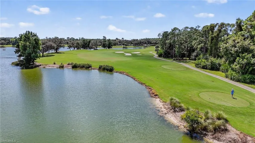 Bird's eye view of a local golf course and a nearby body of water