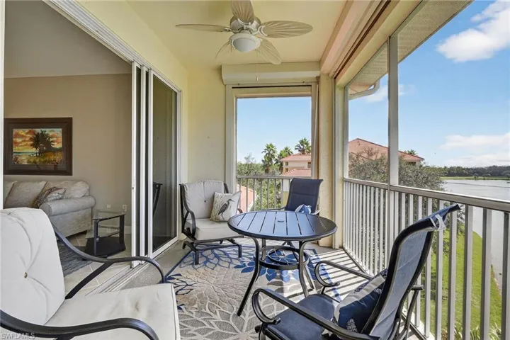 Balcony with a ceiling fan and a water view