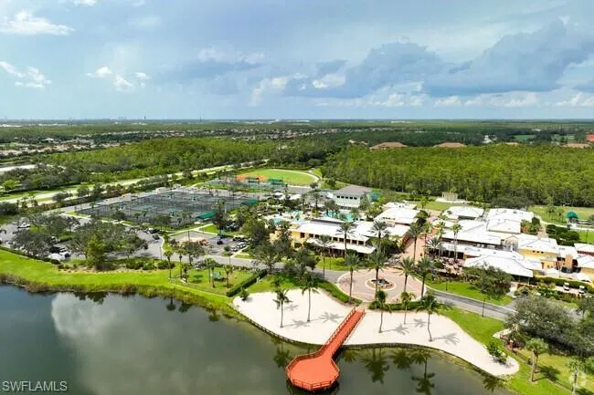 Aerial perspective of suburban area featuring a large body of water