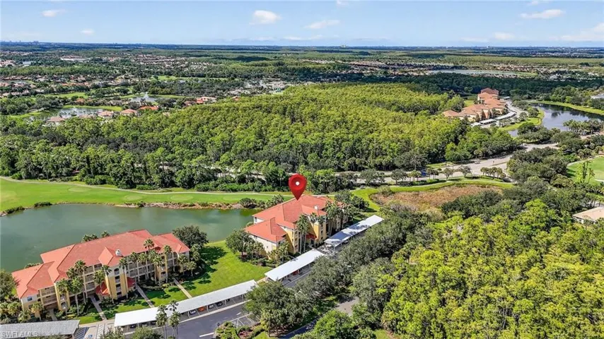 Drone / aerial view of a large body of water and a local golf course