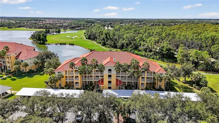 Drone / aerial view of a large body of water and a local golf course