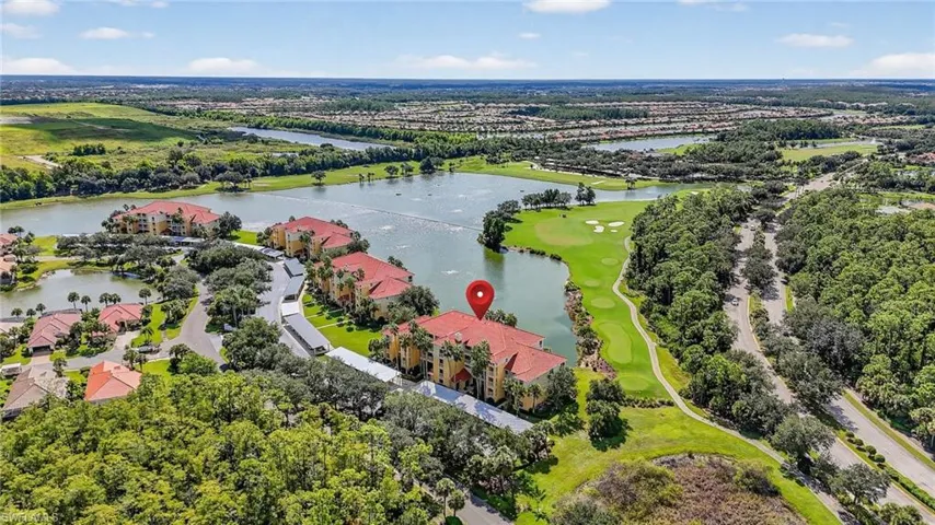 Aerial view of a large body of water and a local golf course