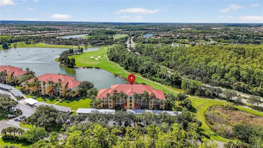 Aerial view of a golf course and a large body of water