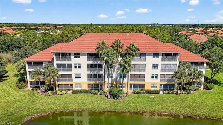 Bird's eye view of apartment complex and a large body of water