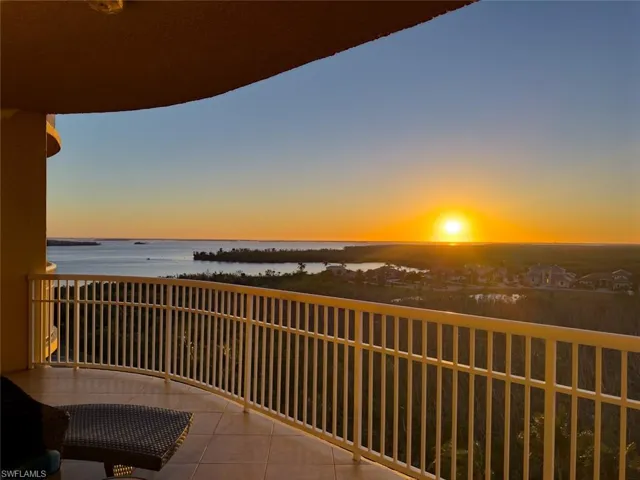 Balcony at dusk with a water view