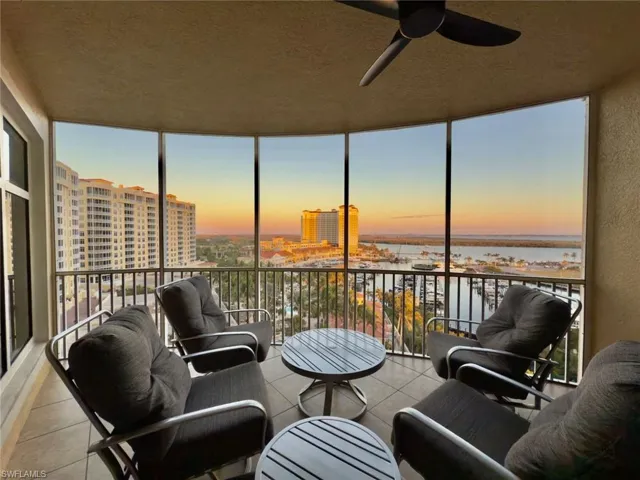 Screened Lanai with ceiling fan and a marina water view