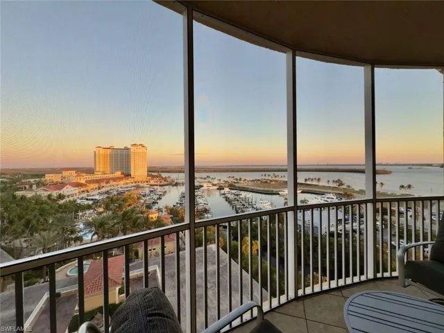 Sunroom featuring a water view