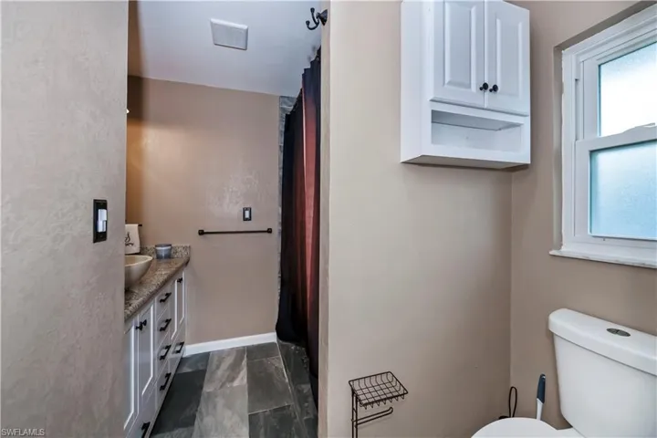 Bathroom with toilet and vanity