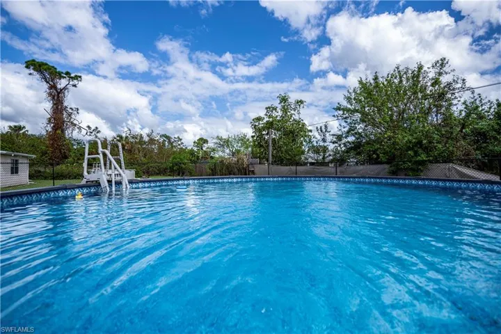 View of swimming pool featuring a water slide