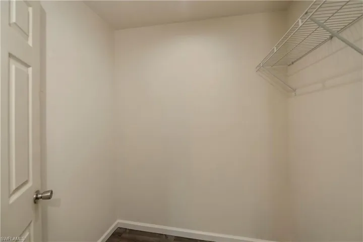 Walk in closet featuring wood-type flooring