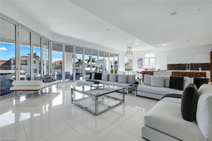 Expansive living area with Thassos marble floors, Solar Innovations glass doors