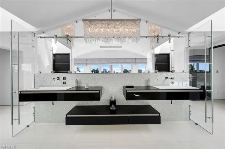 Master bathroom featuring custom cabinetry, Bisazza mosaic tile, Dornbracht fixtures, and Swarovski lighting.