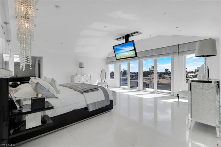 Fourth-floor master bedroom with Thassos marble floors, custom lighting, and stunning views.