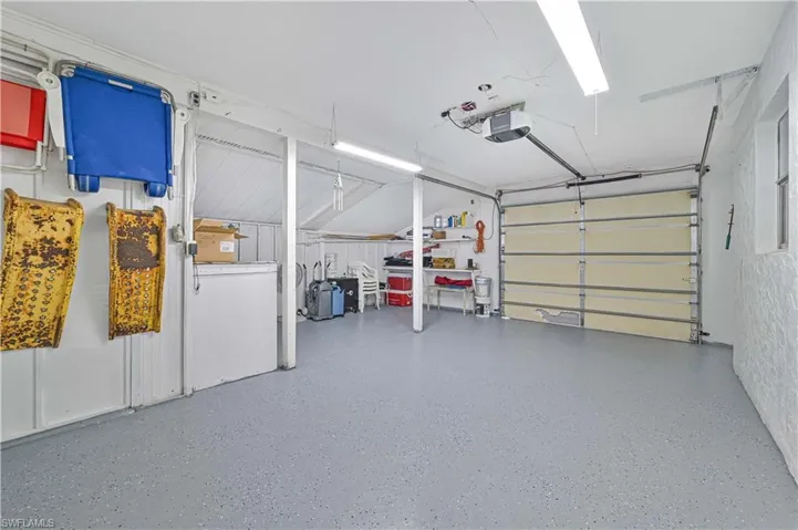 Garage featuring a garage door opener