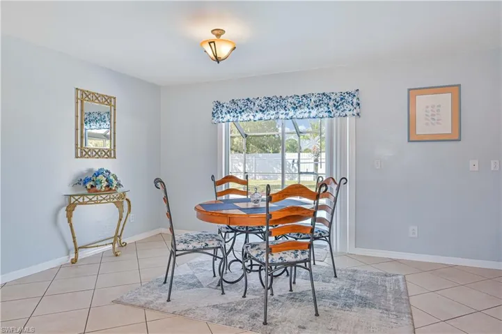 Dining room featuring light tile patterned floors