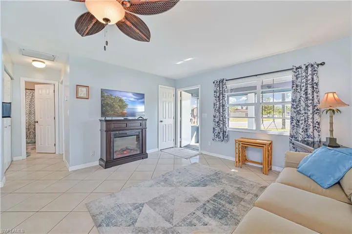 Living room with light tile patterned floors