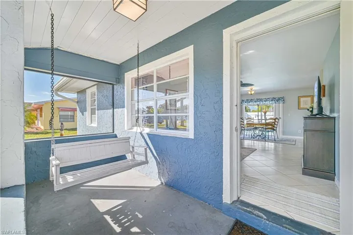 Entrance to property featuring a porch