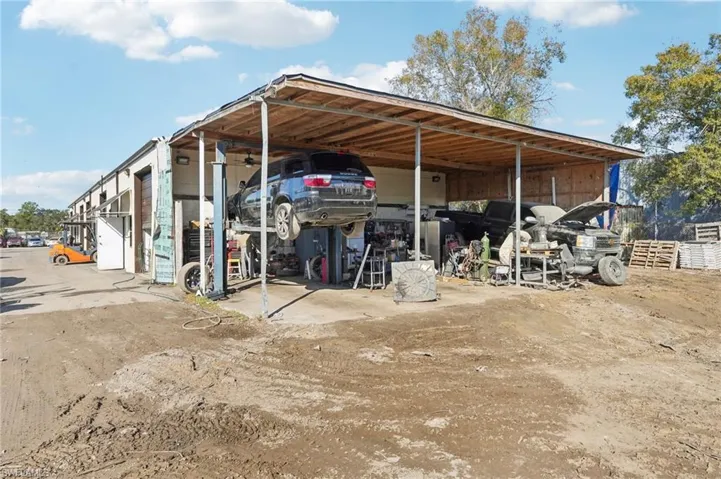 View of parking with a carport