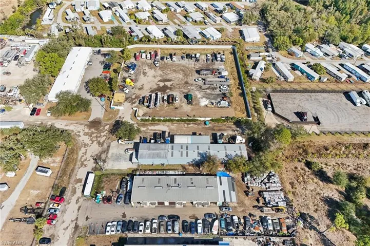 Aerial overview of property's location featuring an industrial area