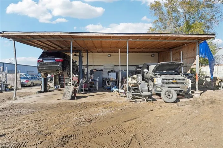 View of parking featuring a carport