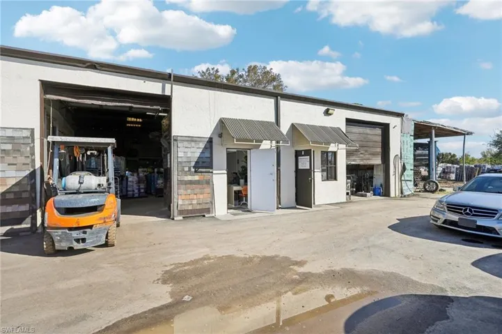 View of commercial location featuring a garage