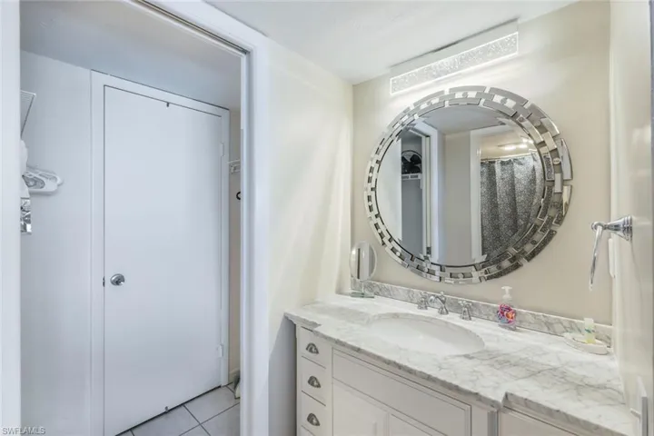 Bathroom with tile flooring and large vanity