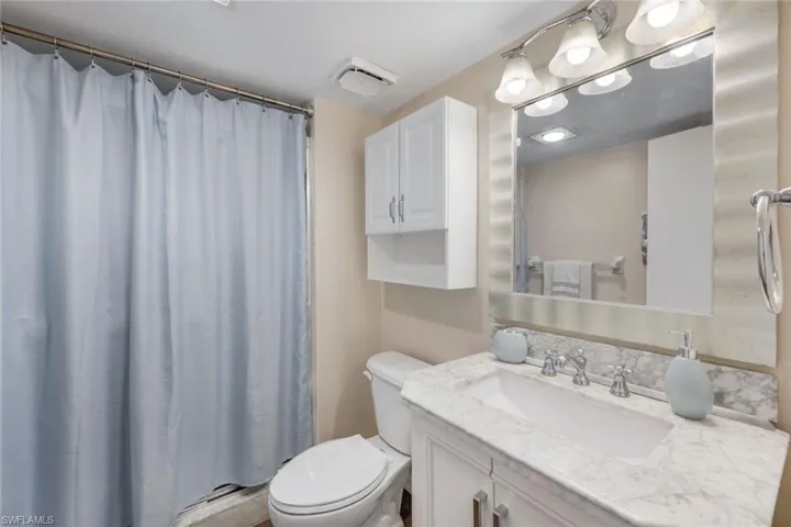 Bathroom with toilet and vanity