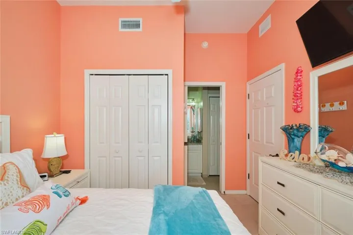 Bedroom featuring a closet and ensuite bath