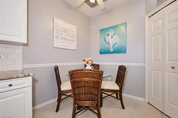 Dining room featuring ceiling fan and baseboards