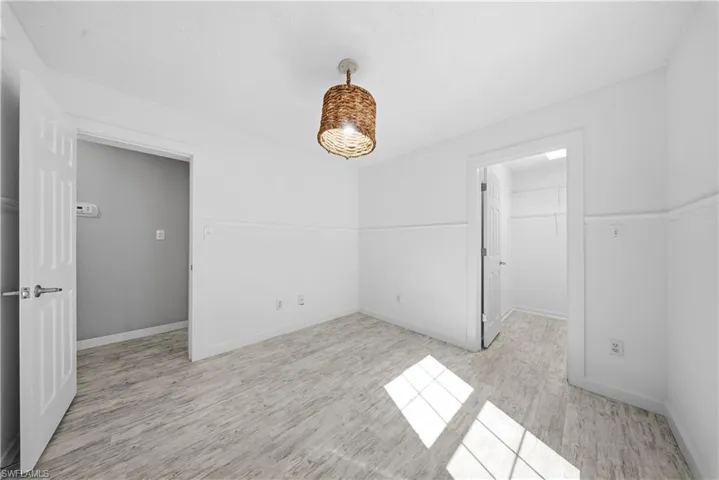 Spare room with light wood finished floors and baseboards