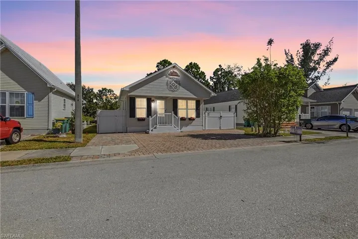 View of front of property with a gate