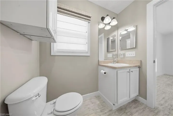 Half bath with vanity and toilet