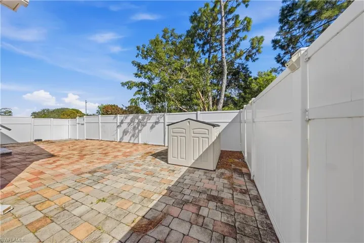 Fenced backyard with a patio area