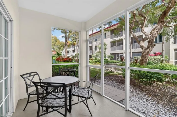 Sunroom / solarium featuring outdoor dining space