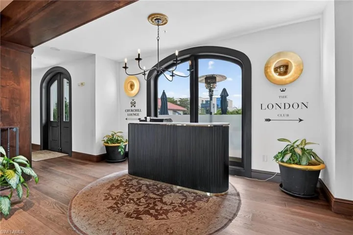 Reception area with arched walkways and suspended lighting
