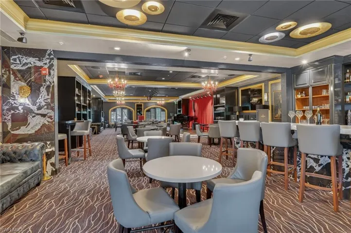 Lobby featuring a tray ceiling and ornamental molding
