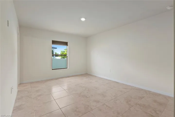 Spare room featuring light tile patterned floors and recessed lighting