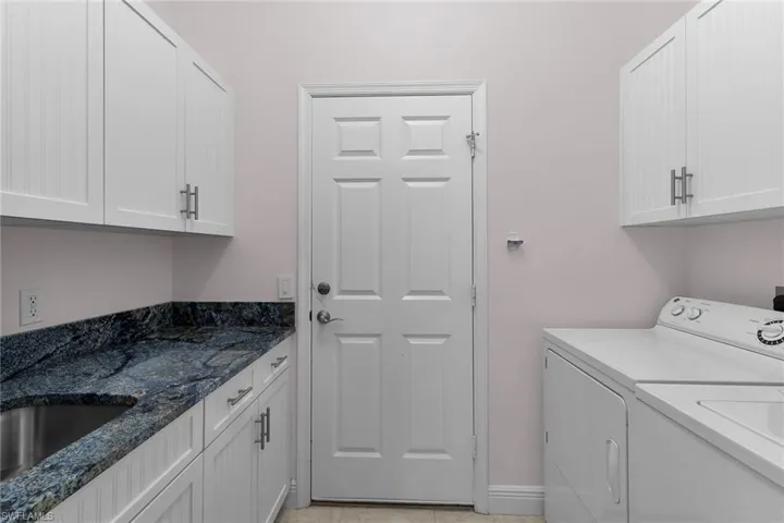 Laundry area with cabinet space and independent washer and dryer