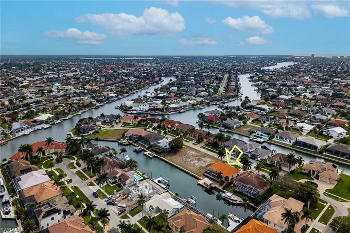 View of property location featuring nearby suburban area and a nearby body of water
