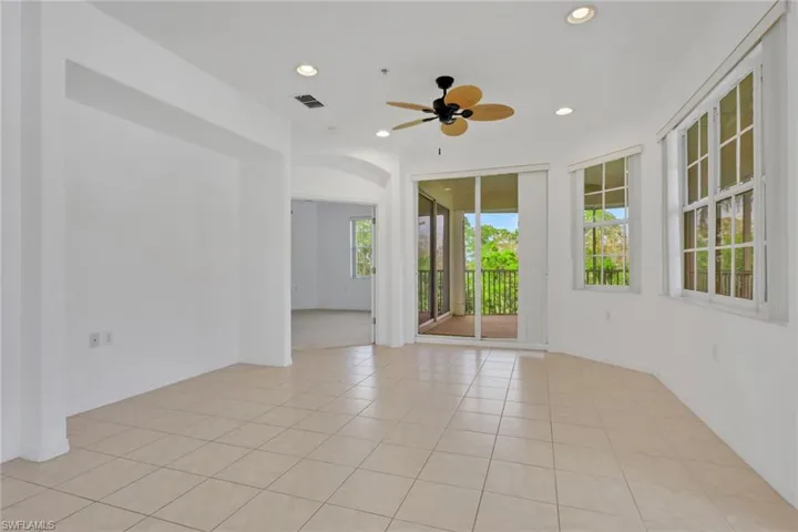 Spare room with recessed lighting, light tile patterned floors, and ceiling fan