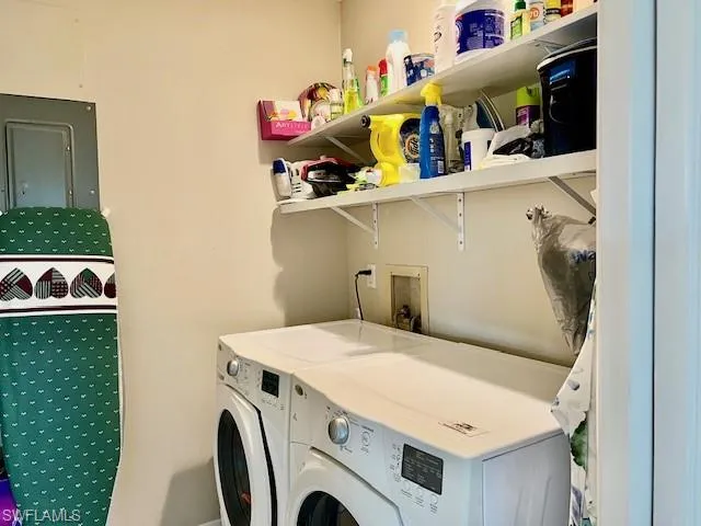 Laundry room with washing machine and dryer