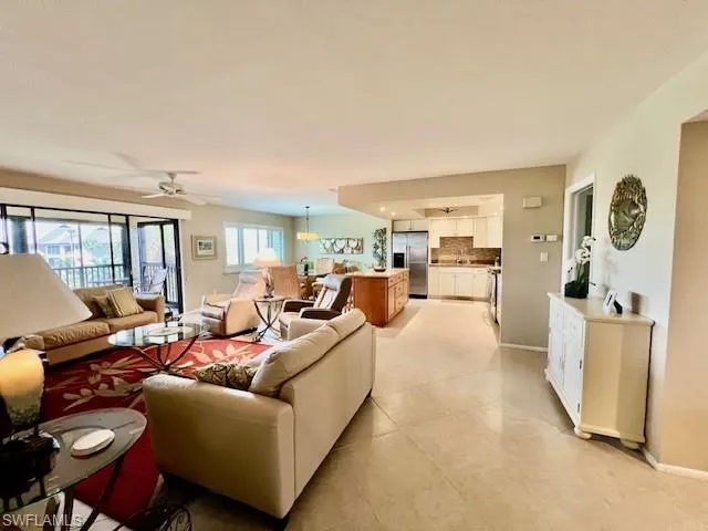 Living room featuring ceiling fan