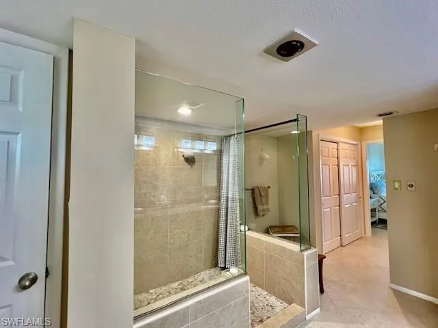 Bathroom with tiled shower