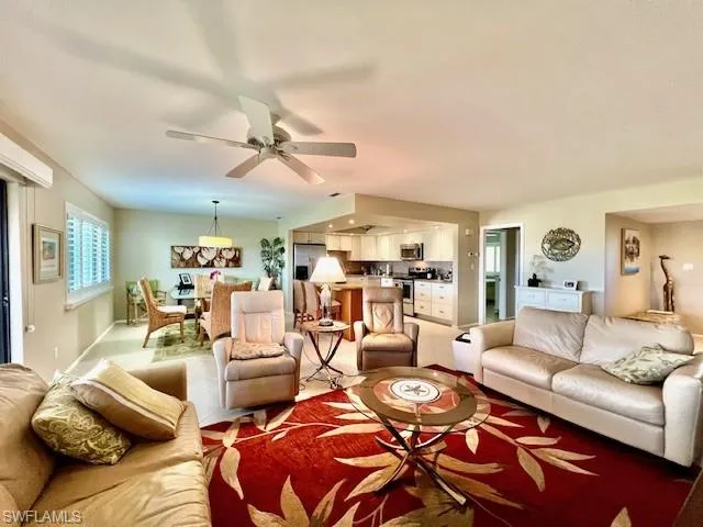 Living room featuring ceiling fan