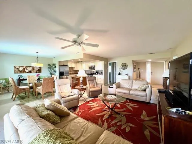 Living room featuring ceiling fan