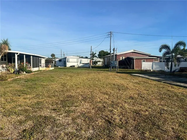 View of yard featuring fence