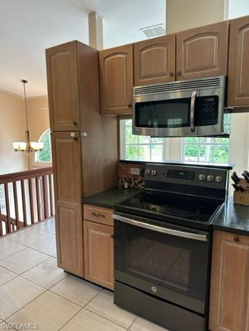 Kitchen with Breakfast Bar Open to Formal Dining views 360 views of living area