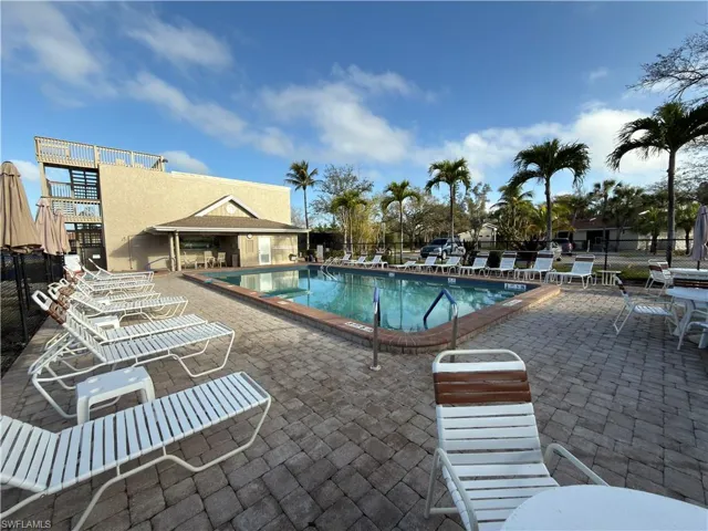 Community pool with a patio area