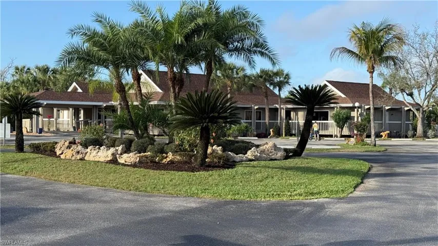 View of front facade with asphalt driveway
