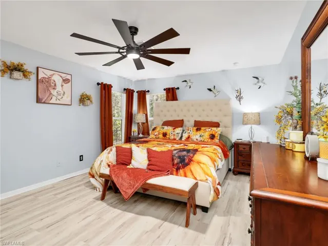Bedroom featuring light wood finished floors and ceiling fan